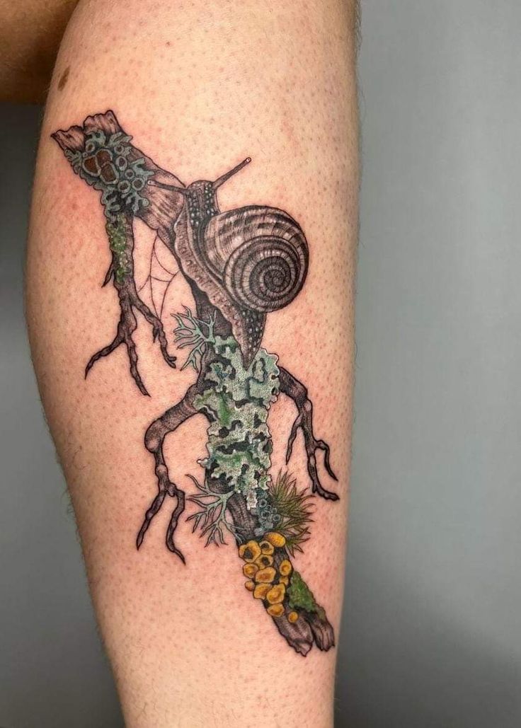 a tattoo on the leg of a person with an insect crawling through it's legs