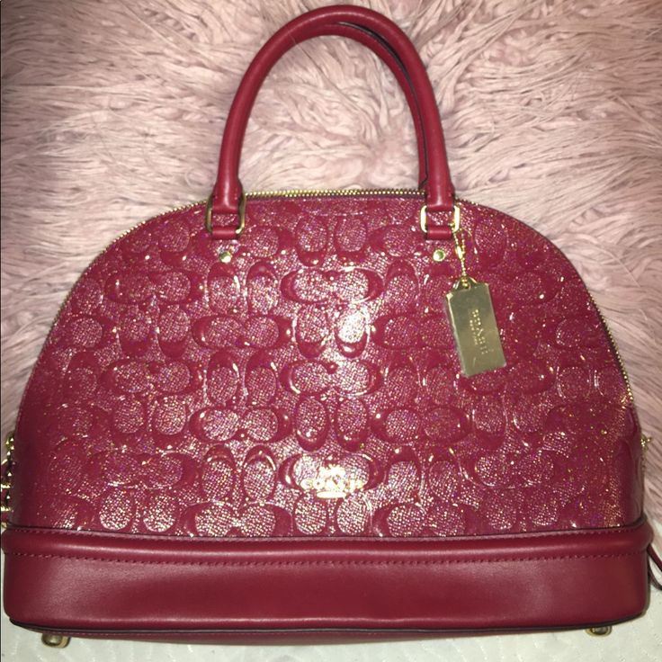 Red/Burgundy Color. Never Worn Brand New Coach Bag, It Is Not My Style But It Is A Cute Purse. Has Gold Accents. Designer Burgundy Satchel Bag, Designer Burgundy Bag With Handles, Designer Burgundy Crossbody Satchel, Designer Burgundy Satchel With Detachable Handle, Designer Burgundy Satchel With Top Handle, Designer Burgundy Top Handle Satchel, Designer Burgundy Satchel For Evening, Chic Burgundy Coach Bag, Designer Burgundy Satchel For Shopping