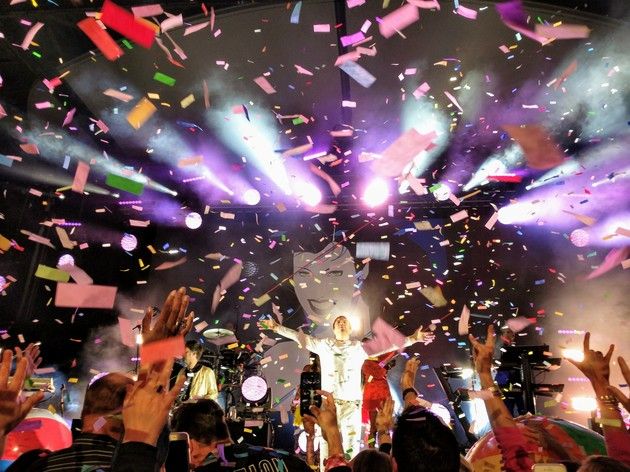 confetti is thrown in the air at a concert