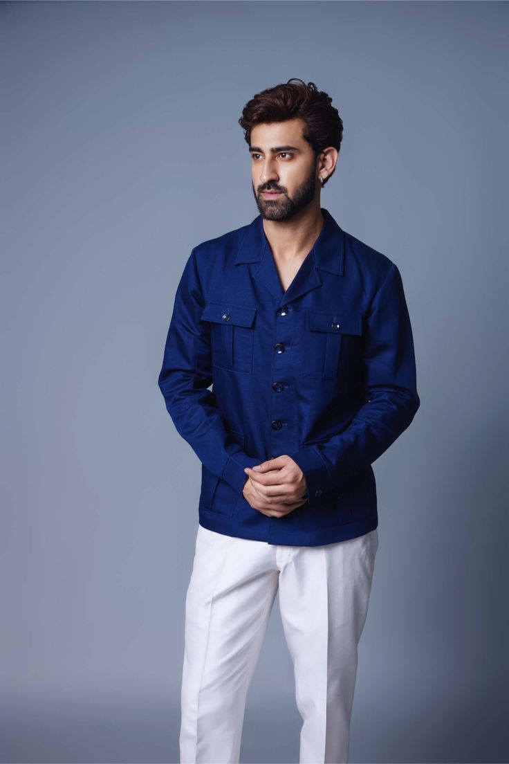 Editor's Note Introducing a navy blue solid shacket, a versatile and timeless wardrobe staple. This shacket combines the structure of a shirt with the functionality of a jacket, making it perfect for layering or wearing on its own. The deep navy blue color adds a touch of sophistication and versatility, allowing for easy coordination with a variety of outfits. Crafted from high-quality materials, this navy blue solid shacket offers both comfort and style, making it a must-have piece for any fash Navy Button-up Outerwear With Patch Pockets, Blue Long Sleeve Shirt With Patch Pockets, Navy Button-up Shirt With Pockets, Navy Button-up Tops With Pockets, Navy Blazer With Welt Pockets, Long Sleeve Denim Jacket With Welt Pockets, Long Sleeve Denim Jacket With Flap Pockets, Blue Long Sleeve Top With Patch Pockets, Navy Collared Outerwear With Buttoned Pockets