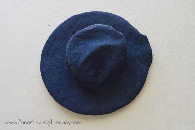 a blue hat sitting on top of a white table