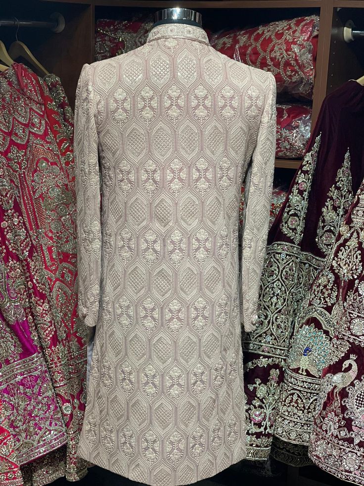 Sienna brown excellent detailing of vintage motifs accentuated with thread and sequence details with mandarin collar in cut dana and zardozi work. Available with matching churidar. Size: 38,44 Ready to Ship! Festive Designer Sherwani With Chikankari Embroidery, Reception Bandhgala With Zari Work, Festive Semi-stitched Bandhgala With Chikankari Embroidery, Long Sleeve Sherwani With Cutdana For Reception, Reception Sherwani With Cutdana And Long Sleeves, Traditional Straight Kurta Churidar For Reception, Straight Kurta Nehru Jacket With Intricate Embroidery For Reception, Long Sleeve Kurta With Dabka For Reception, Reception Nehru Jacket With Intricate Embroidery