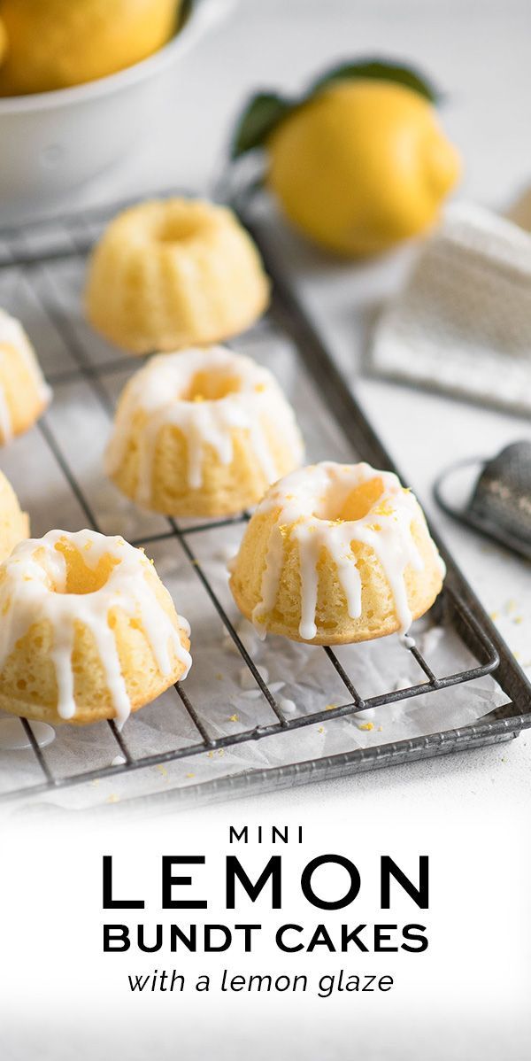 mini lemon bundt cakes on a cooling rack with lemons in the back ground