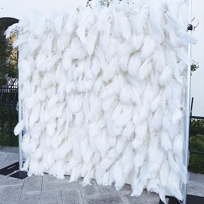 there is a large pile of white feathers on display