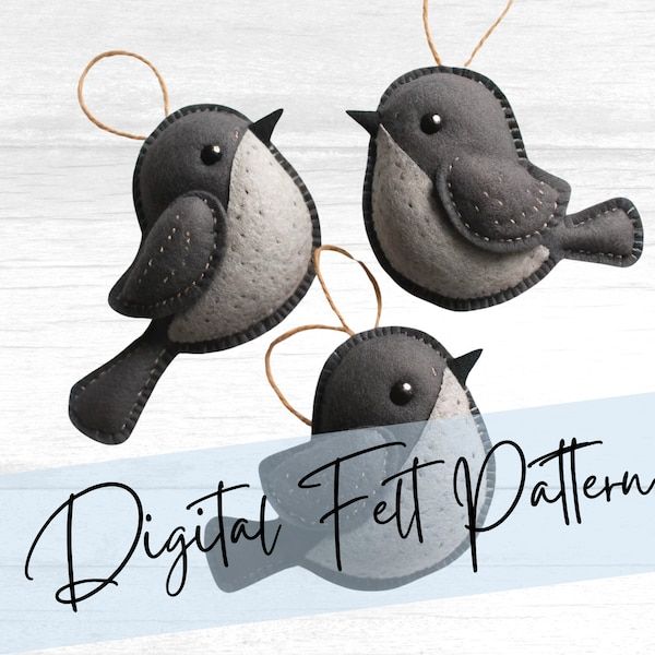 two felt birds hanging from strings on a white wooden background with the words digital felt patterns