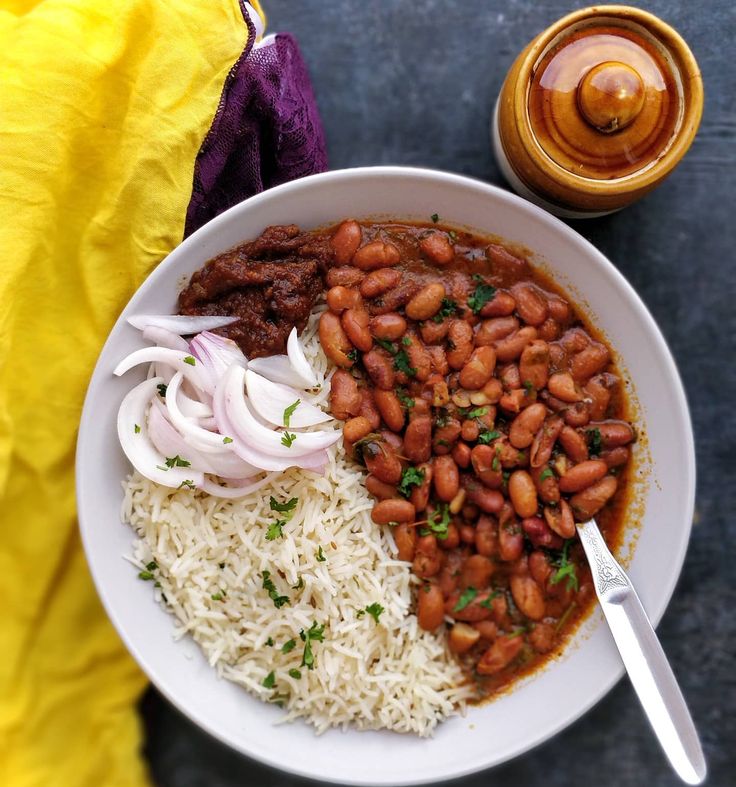 a white bowl filled with beans and rice