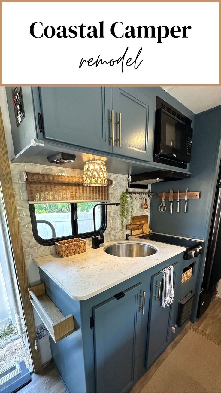 an rv kitchen with blue cabinets and white counter tops is featured in the article coastal camper remodel