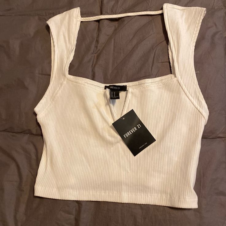 Brand With Tags! Cream Colored Crop Top By F21 Size: M Check Out The Rest Of My Closet For Similar Items A Huge Variety Of Everything Else In All Posh Markets! Bundle More = Ave More Forever 21 Fitted Trendy Tank Top, Trendy Fitted Tank Top By Forever 21, Trendy Fitted Tank Top Forever 21, Trendy Forever 21 Crop Top For Day Out, Trendy Forever 21 Tank Top For Day Out, Trendy Forever 21 Tops For Day Out, Forever 21 White Top For Night Out, Fitted Forever 21 Tank Top For Day Out, Forever 21 Casual Crop Top For Night Out