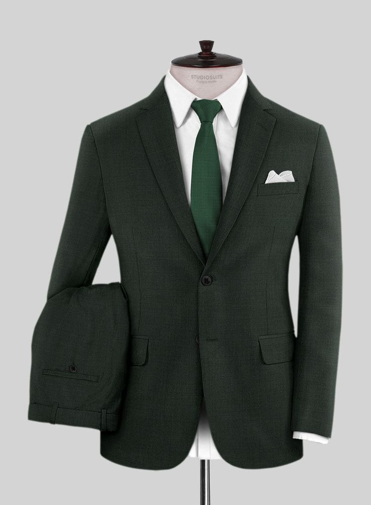 Be the trendsetter at your next casual venue or occasion wearing our Scabal Dark Green Wool suit which is not just unique in hue but will make you feel comfortable. Crafted from 100% wool, the suit is a perfect piece for the gentlemen with most discerning taste. Wear it with a matching waistcoat, a white shirt, patterned tie and brown brogue shoes. 
 
 Look Includes  Scabal Dark Green Wool Fabric  Two Button Jacket Style   Notch Lapel  Horn Royal Black Buttons  Single Vent  Three Cuff Buttons  T Sharkskin Suit, Grey Wool Suit, Flannel Suit, Tailored Suit, Herringbone Tweed, Grey Tweed, Silk Suit, Tweed Suits, Linen Suit