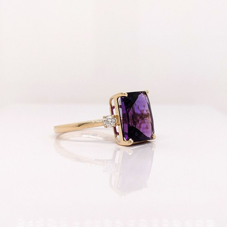 This cocktail ring features a stunning vibrant deep purple amethyst in 14K gold with diamond accents. This statement ring makes for a stunning accessory to any look! A fancy ring design perfect for an eye-catching engagement or anniversary. This ring also makes a beautiful February birthstone ring for your loved ones. February Birthstone Ring, Designer Silver Jewellery, Semi Mount Ring, Purple Amethyst Ring, Fancy Rings, Jewelry Showcases, Ruby Sapphire, February Birthstone, Royal Purple