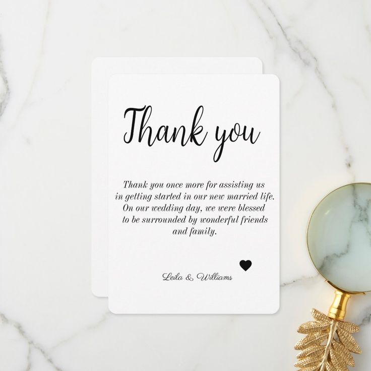 a thank card with a magnifying glass next to it on a marble surface