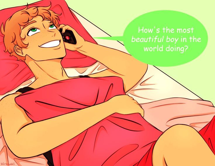 a man laying in bed talking on a cell phone with a speech bubble above his head