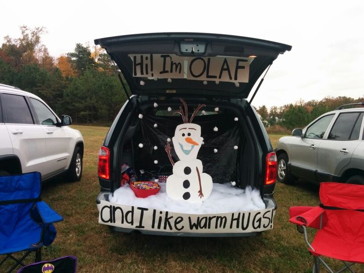 the back end of a car with a snowman on it's tailgate