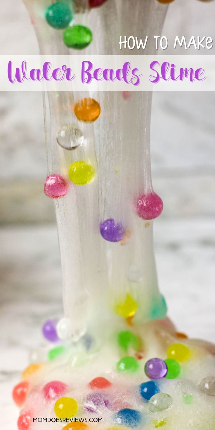 a glass vase filled with gummy bears and the words how to make water beads slime