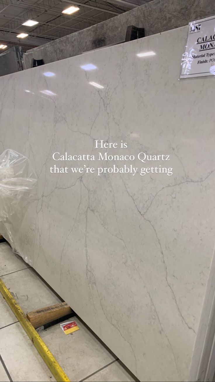 a large white marble counter top in a store with the caption's message on it