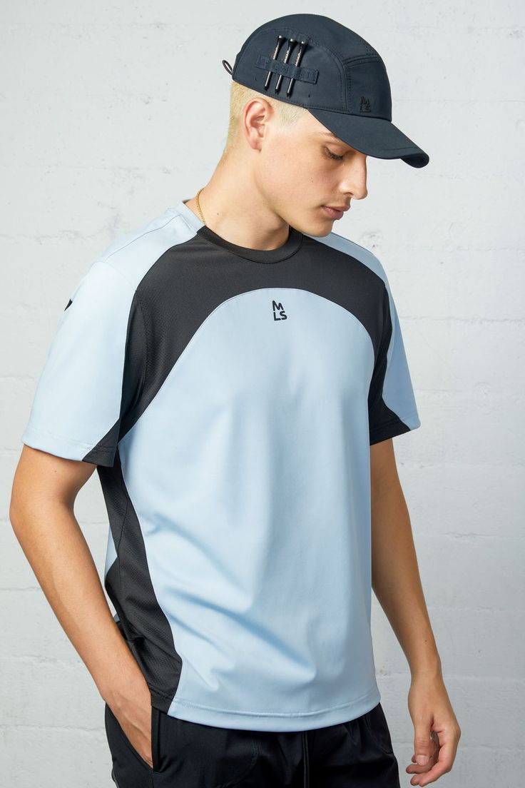 The Trident Seamed Workout Tee offers optimal performance with its unique design. Featuring contrast mesh vents, this tee allows for maximum breathability and comfort during exercise. Stay on top of your game with this workout essential. Body: 82% Polyester 18% Spandex Mesh: 98% Dacron 2% Spandex Models are 6'2" and wearing a size medium Blue Breathable T-shirt For Training, Sporty Dri-fit T-shirt For Gym, Sporty Dri-fit T-shirt For Workout, Functional Breathable T-shirt For Light Sports, Breathable Crew Neck T-shirt, Blue Short Sleeve Training T-shirt, Technical Short Sleeve Tops For Light Sports, Functional Dri-fit T-shirt For Sports, Moisture-wicking Jersey Tops For Light Sports