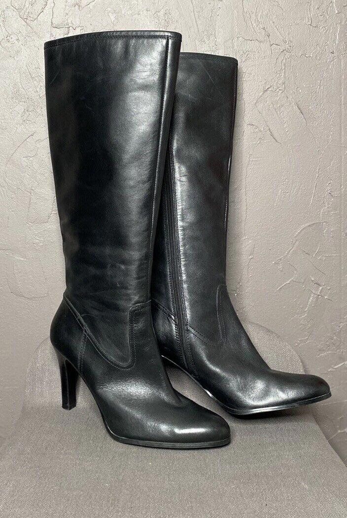 "Bryce" Black Knee High Heeled Leather Boots from Ralph Lauren size 10B. Gorgeous Luxe Leather is buttery smooth. Almond toe shape.  Lightly cushioned insoles. 4" cone heel. Full zipper on interior. Fit in calf is a bit wider than standard, please message if you need help with detailed measurements to make sure. In Excellent condition. Some wear at interior heel on lining, no other major flaws. It's almost like the wear is from trying on? Just guessing based on n wear to soles and excellent condition. Measurements taken from outside and bottom of boots. Shaft : 17" measured at zipper Width @ top of Shaft : 7.5" Width @ Ankle : 5.5" Width @ Arch : 3" Width @ Ball : 4" Heel : 4" Please message for additional details or help with sizing. Ships in 24 hours (or less) from purchase. Ralph Lauren Boots, Leather High Heel Boots, Knee High Heels, High Heel Boots Knee, Black Knees, High Heel Boots, Boot Shoes Women, Knee High, Leather Boots