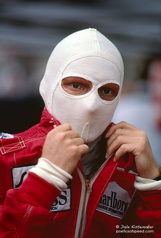 a person wearing a red jacket and white mask