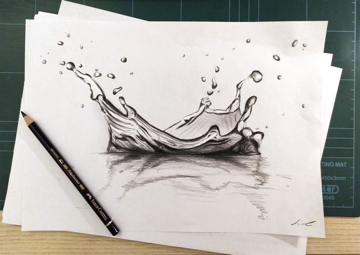 a pencil drawing of a crown on top of some paper with water droplets coming out of it