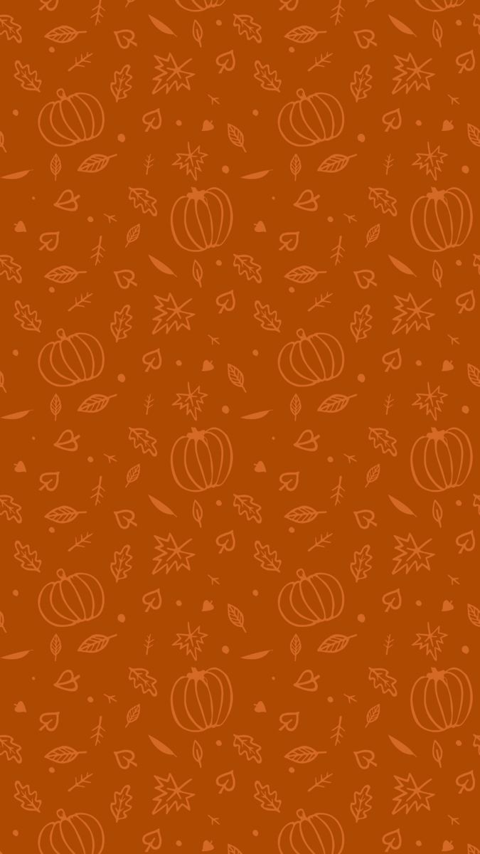 an orange background with pumpkins and leaves