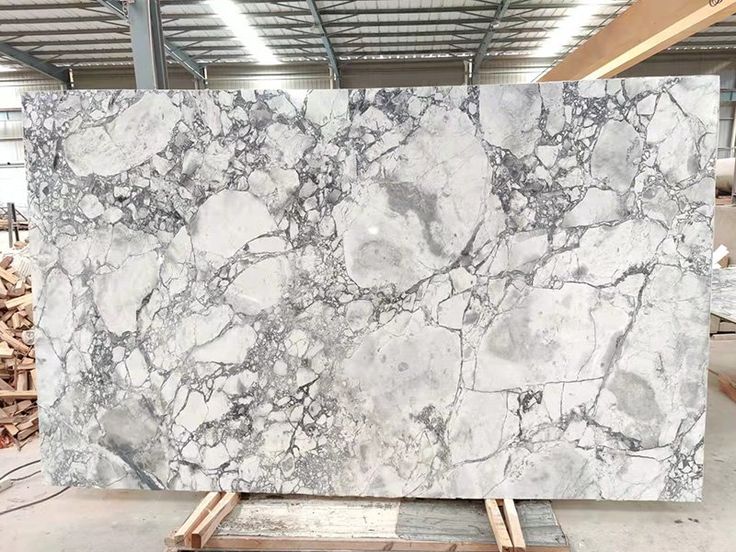 a large slab of white marble in a warehouse