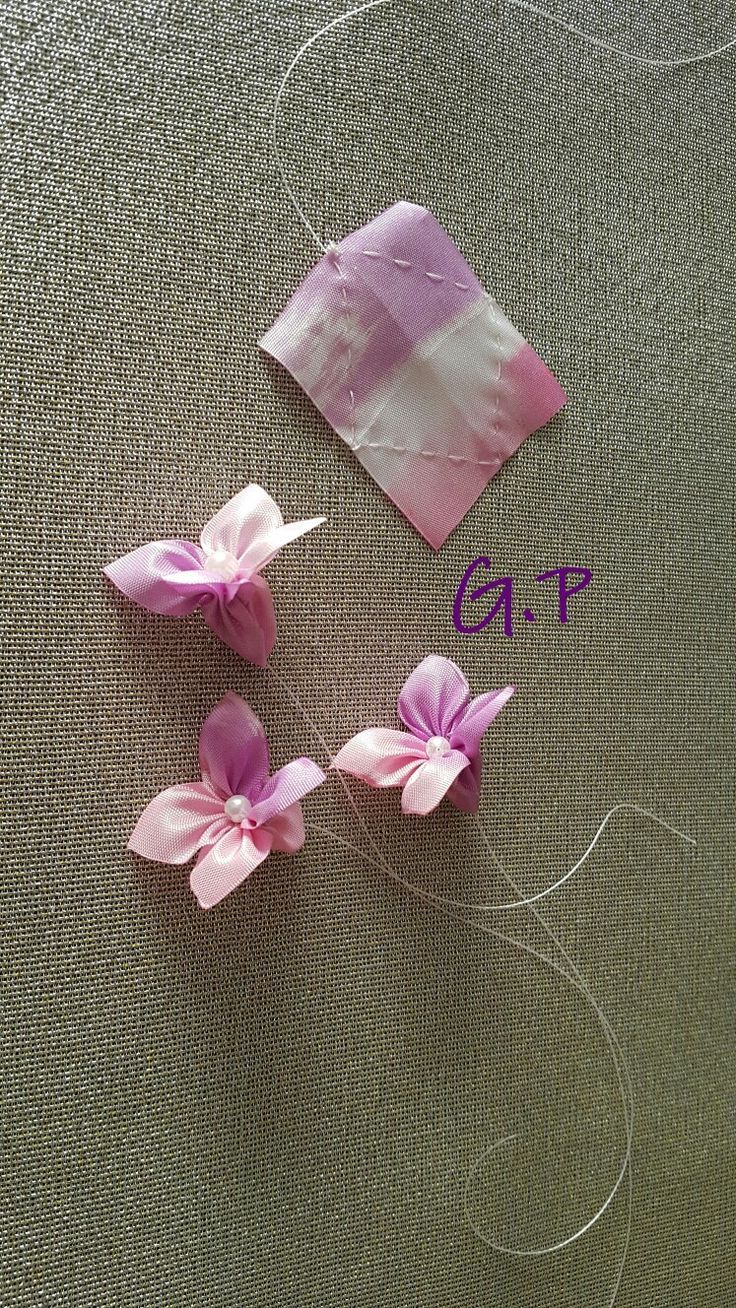 three pieces of fabric with pink flowers on them