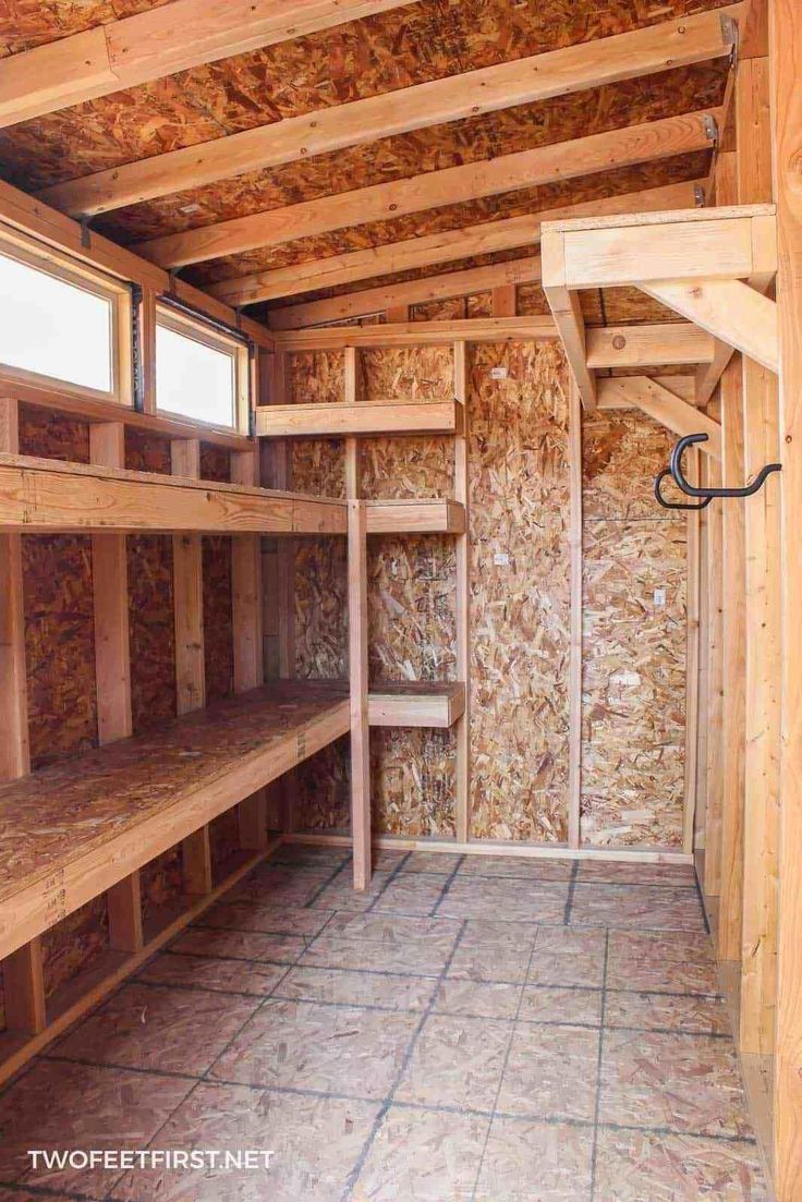 the inside of a storage room with wooden shelves