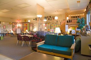 a room filled with lots of tables and chairs