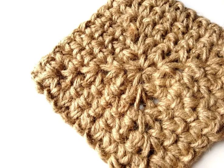 a crocheted dishcloth on a white surface