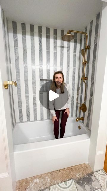 a woman sitting in a bathtub with her legs crossed