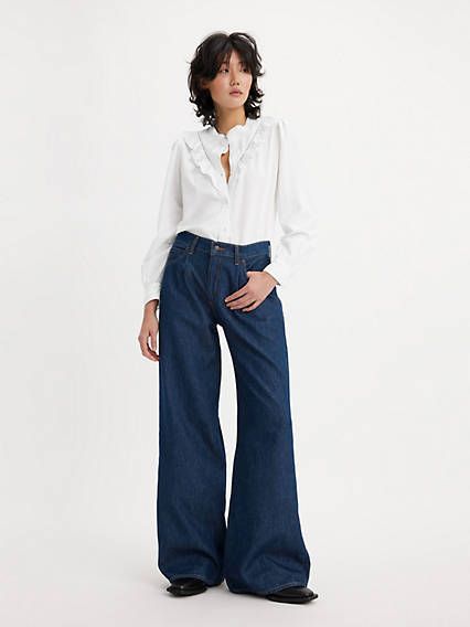 The kind of jeans you might steal from your parent's closet;but baggier. With a mid rise, wide-leg cut and straight leg, our Baggy Dad Wide-Leg jeans are relaxed yet flattering with extra room for a subtle edge. A fit inspired by the way dads rock their jeans;but baggier Featured in a mid rise with a wide leg Roomy and slouchy through the hip and thigh Wide Leg Skater Jeans Outfit, Wide Leg High Waisted Jeans, Pleated Wide Leg Jeans Outfit, Levis Baggy Dad Jeans, 80's Clothes, Wide Leg Baggy Jeans, Baggy Jeans For Women, Let's Get Lost, Fit Inspired