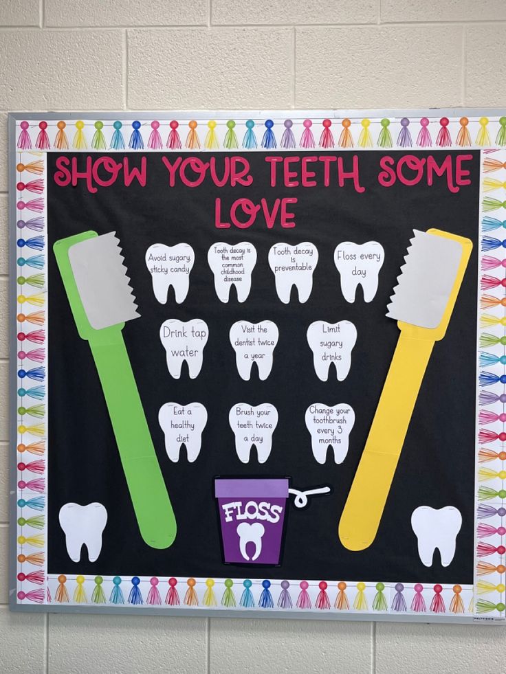 a bulletin board with toothbrushes and toothpaste on it that says show your teeth some love