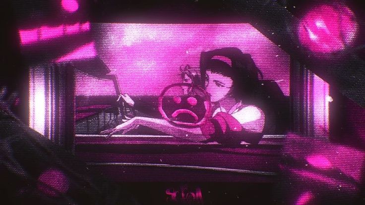 a tv screen with the image of a woman sitting in front of a pink light