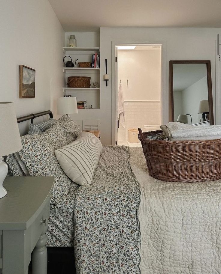 a bedroom with a bed, dresser and mirror in it's centerpieces