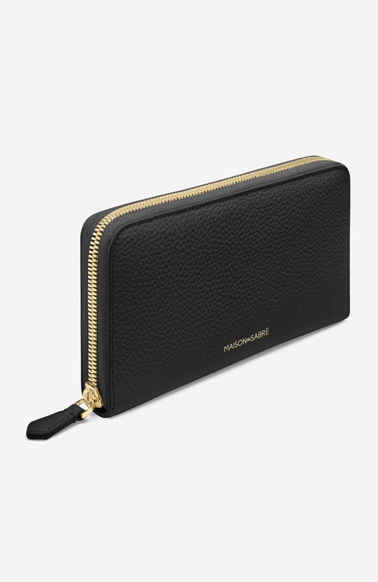 A timeless silhouette built to secure, the Long Zip Wallet protects cards, coins and cash with a full-length polished brass zipper. The sumptuous accessory is fitted with countless surprises including a vivid colour contrast interior once opened. Eight card slots, two flat notes compartments, and a zipped pocket keep valuables snug as the exterior’s elegant rounded corners and full-grain pebbled leather dazzles. A wallet to carry it all, everywhere. Crafted entirely from sustainable, full-grain Luxury Evening Wallet With Zipper Closure, Gold Business Wallet With Coin Pocket, Classic Gold Bifold Coin Purse, Classic Formal Wallet With Zipper Closure, Gold Bifold Wallet For Business, Luxury Gold Wallets For Travel, Luxury Gold Wallet For Travel, Luxury Gold Coin Purse With Card Slots, Formal Gold Coin Purse With Card Slots