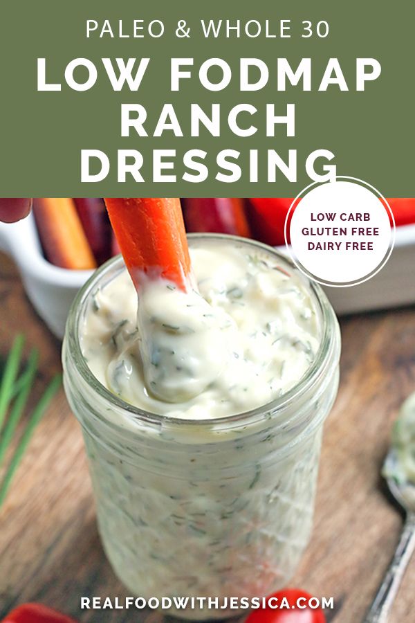 a jar filled with ranch dressing on top of a wooden table