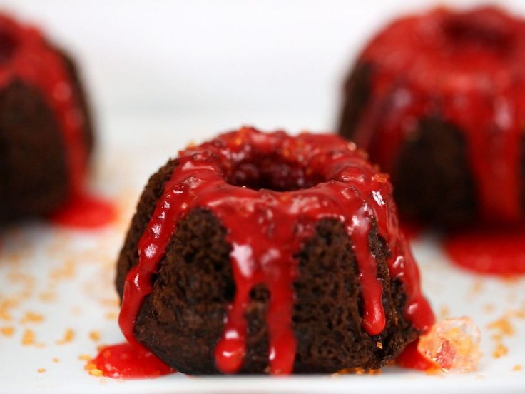 chocolate bundt cake with red icing and drizzled on the top