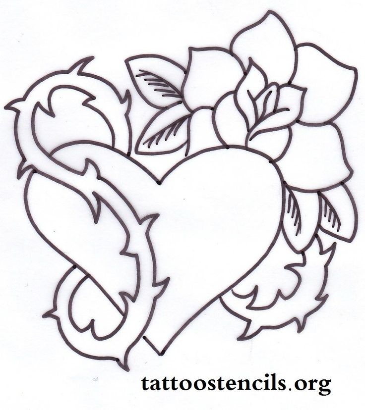 a tattoo heart with roses and leaves on it