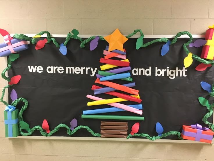 we are merry and bright bulletin board with christmas tree made out of construction paper sticks