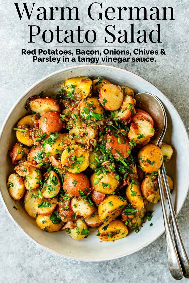 a white bowl filled with potatoes and parsley