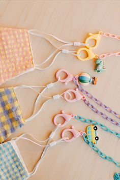 several pairs of scissors and some fabric on a table