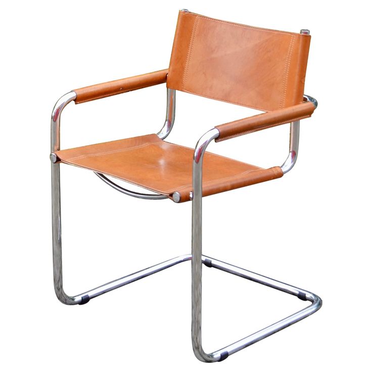 a tan leather chair with chrome frame and arm rests on an isolated white background,