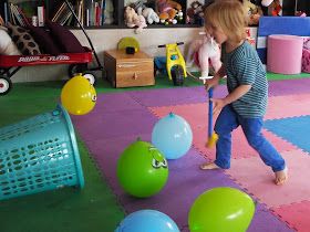 two pictures of children playing with balls in the living room and on the floor, one is