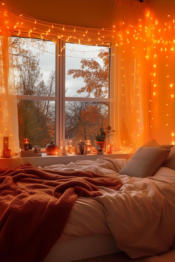 a bed in front of a window with lights on it