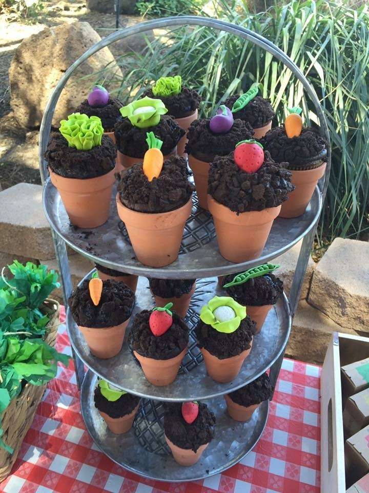 there are cupcakes that have been made to look like plants on top of each other