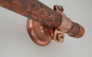 a close up view of a copper colored metal pipe with an eyeball on the end