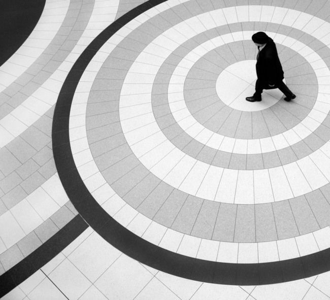 a person is walking through a circular pattern