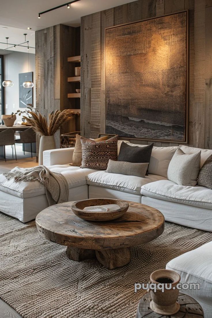 a living room filled with lots of white furniture