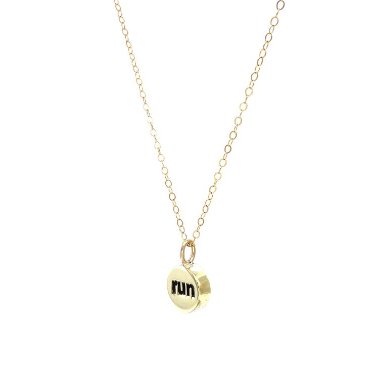 Our Run Charm Necklace is made for those who find joy in the miles, whether you’re a seasoned marathoner, triathlete, or someone who simply loves to run. Featuring a sleek charm available in brass with a gold-filled chain or sterling silver with a sterling silver chain, this necklace celebrates your passion for the sport. The reversible design adds versatility, and you can personalize it further by adding crystal charms for a touch of individuality. Wear it proudly as a reminder of your strength, perseverance, and the miles you've conquered. Perfect as a gift for runners or a little something to motivate yourself through your next race.We hand-forge each charm necklace in our studio. By choosing our necklaces, you're supporting a tradition of handmade excellence, where every piece tells a Gift For Runners, Rolling Ring, Gifts For Runners, Stacking Bands, Fidget Rings, Find Joy, Charm Rings, Spinner Rings, Crystal Charm