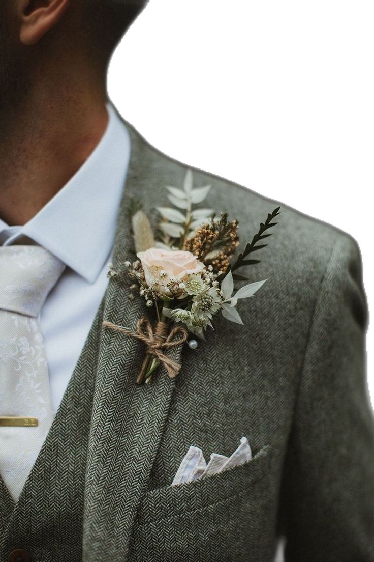 a man in a suit with a boutonniere on his lapel